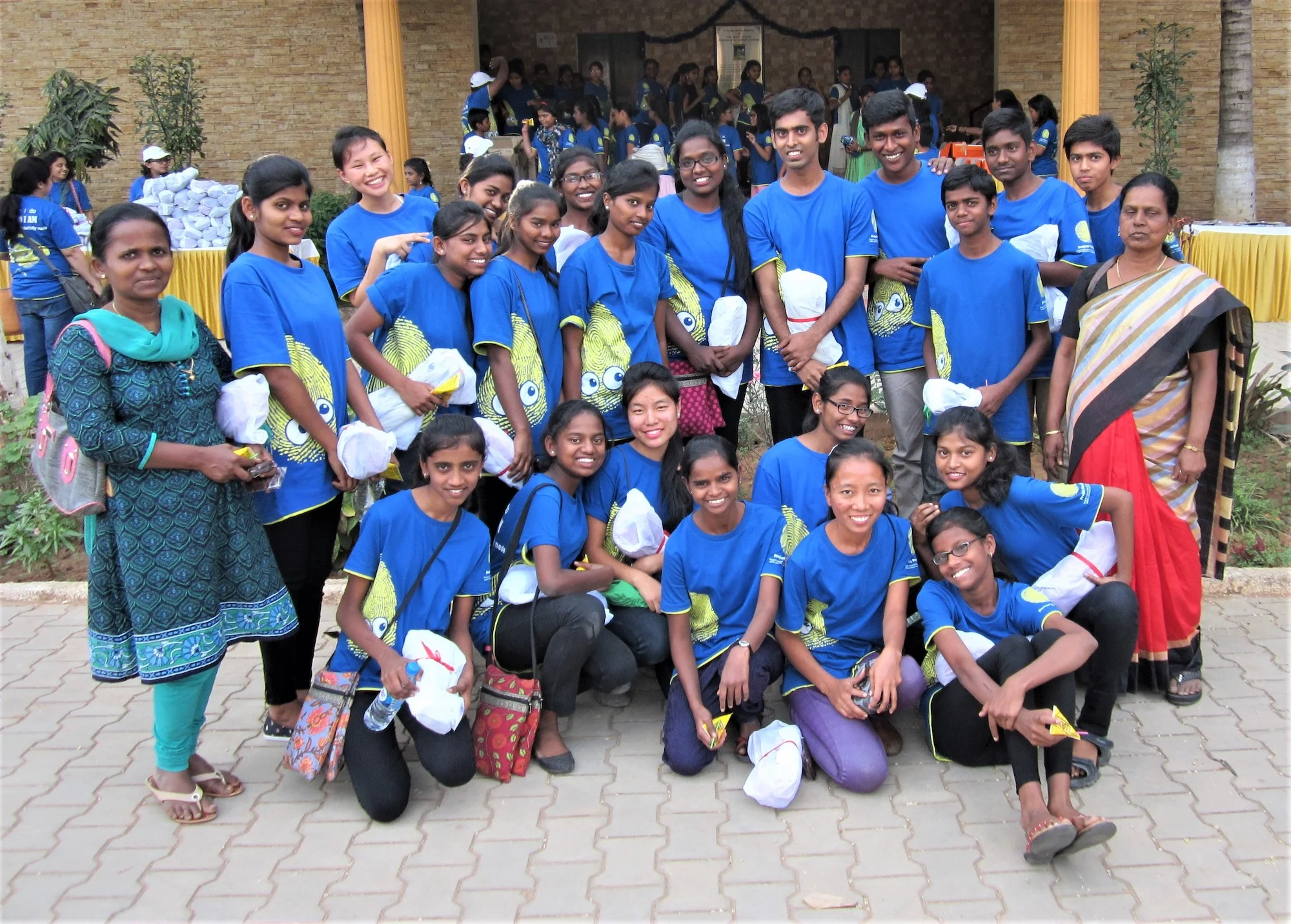 Blessing Home children in matching shirts at a programme
