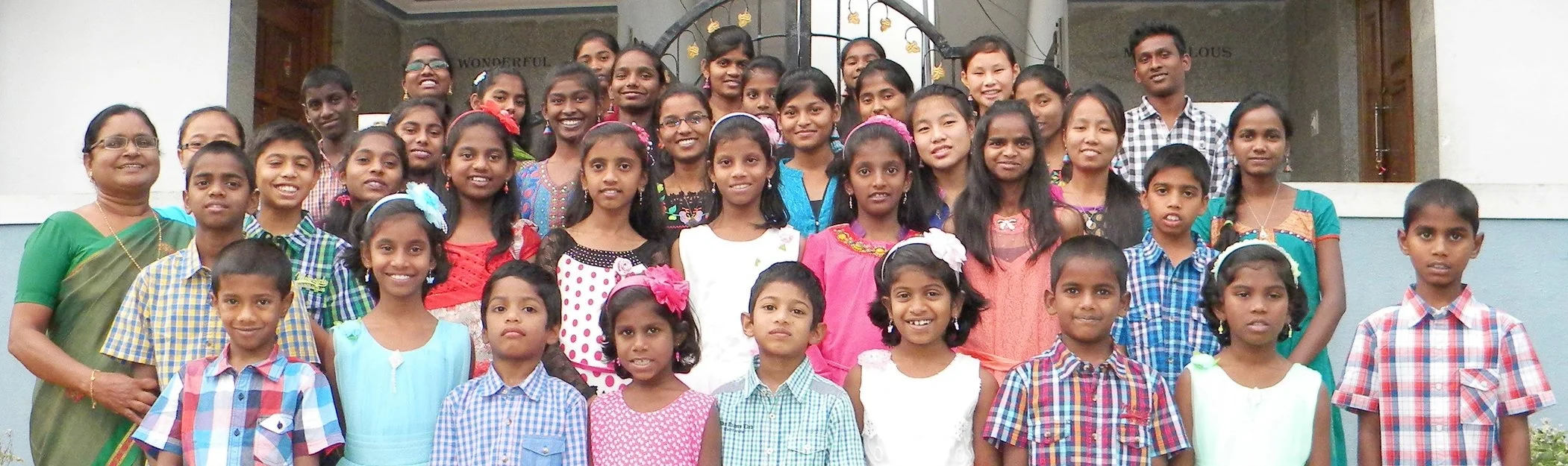 Blessing Home children and staff standing together outdoors
